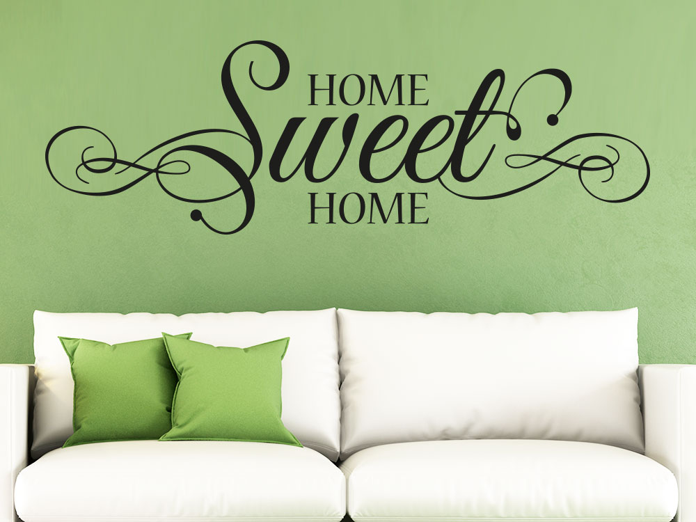 Wandtattoo Home sweet Home Schnörkel  Farbe schwarz auf grüner Wand